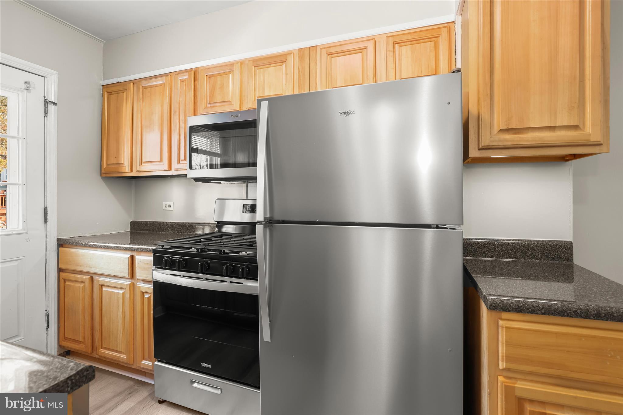 1945 Edgewood Road Towson, MD 21286 - Photo 17 of 46 a white refrigerator freezer and a stove sitting inside of a kitchen