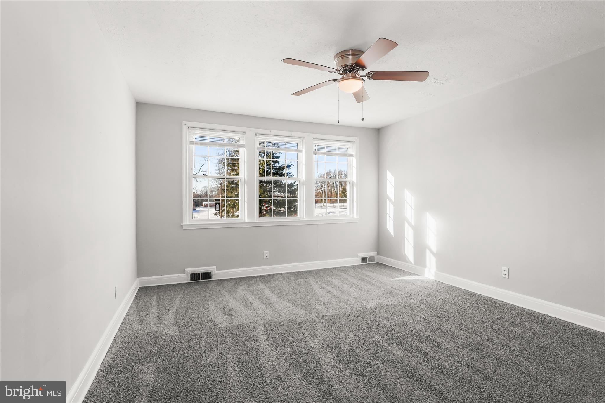 1945 Edgewood Road Towson, MD 21286 - Photo 20 of 46 an empty room with windows and fan