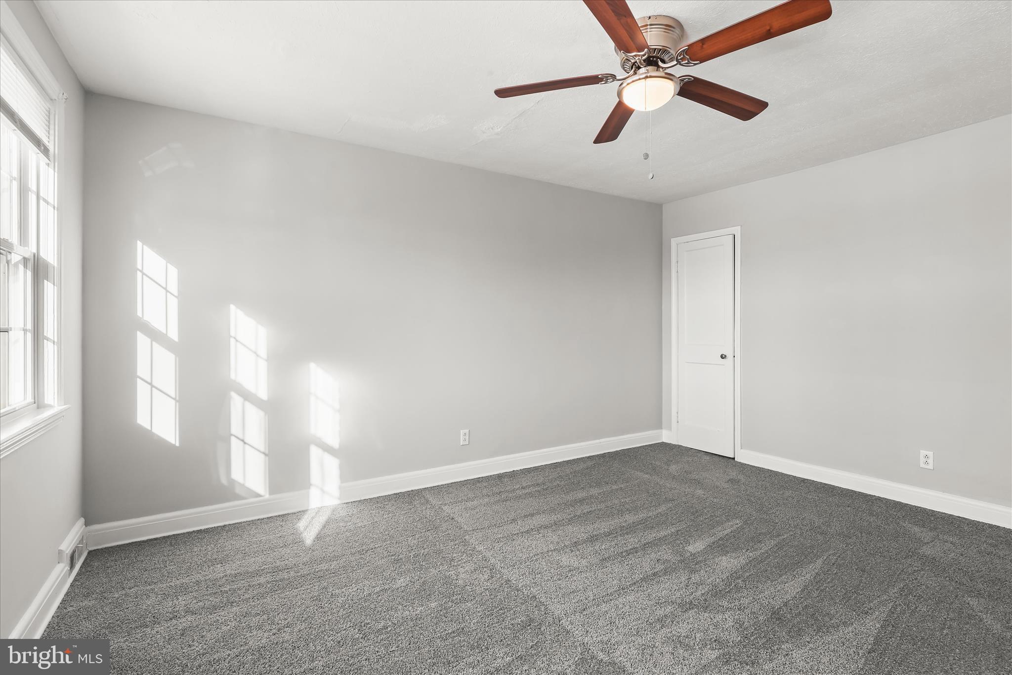 1945 Edgewood Road Towson, MD 21286 - Photo 22 of 46 an empty room with windows and fan