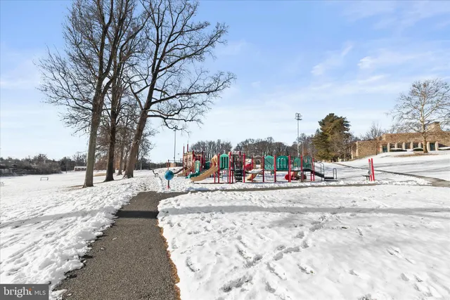 a picture of a bench in front of a building