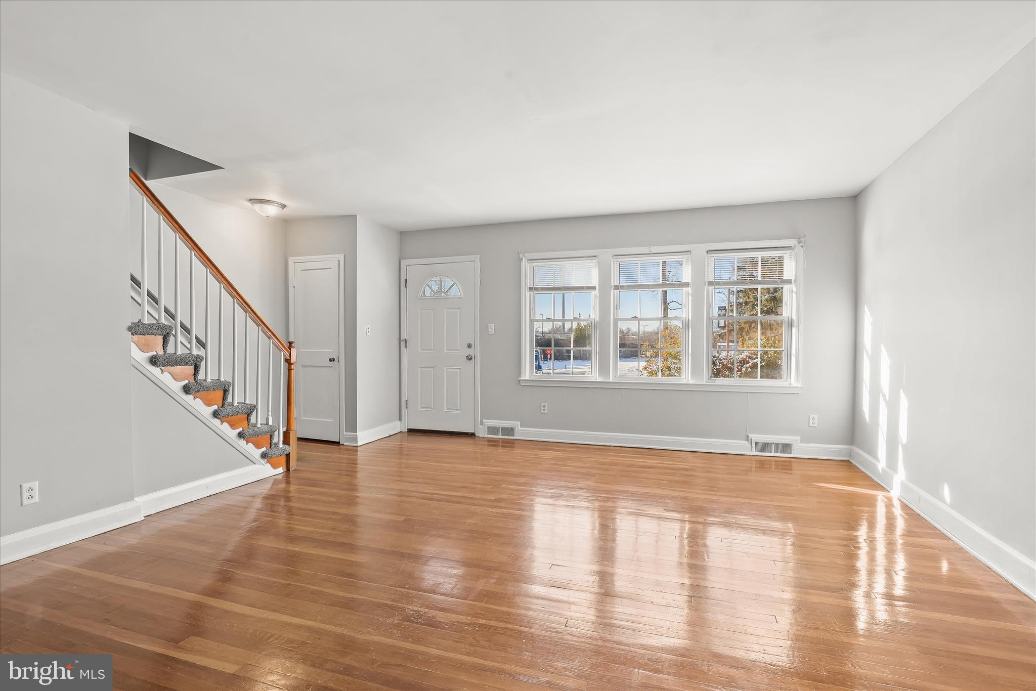1945 Edgewood Road Towson, MD 21286 - Photo 7 of 46 a view of an empty room with wooden floor and a window