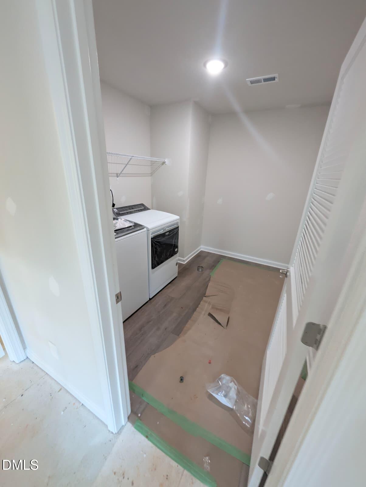 308 Karlov Road Garner, NC 27529 - Photo 21 of 55 walk in closet with wooden floor washer and dryer