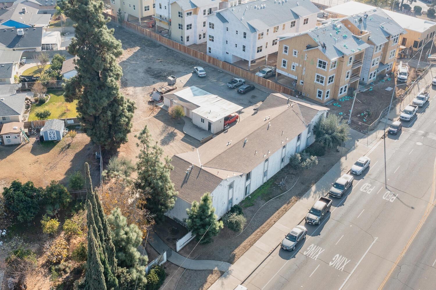 655 East 11th Street Reedley, CA 93654 - Photo 8 of 13 an aerial view of a house with outdoor space and street view