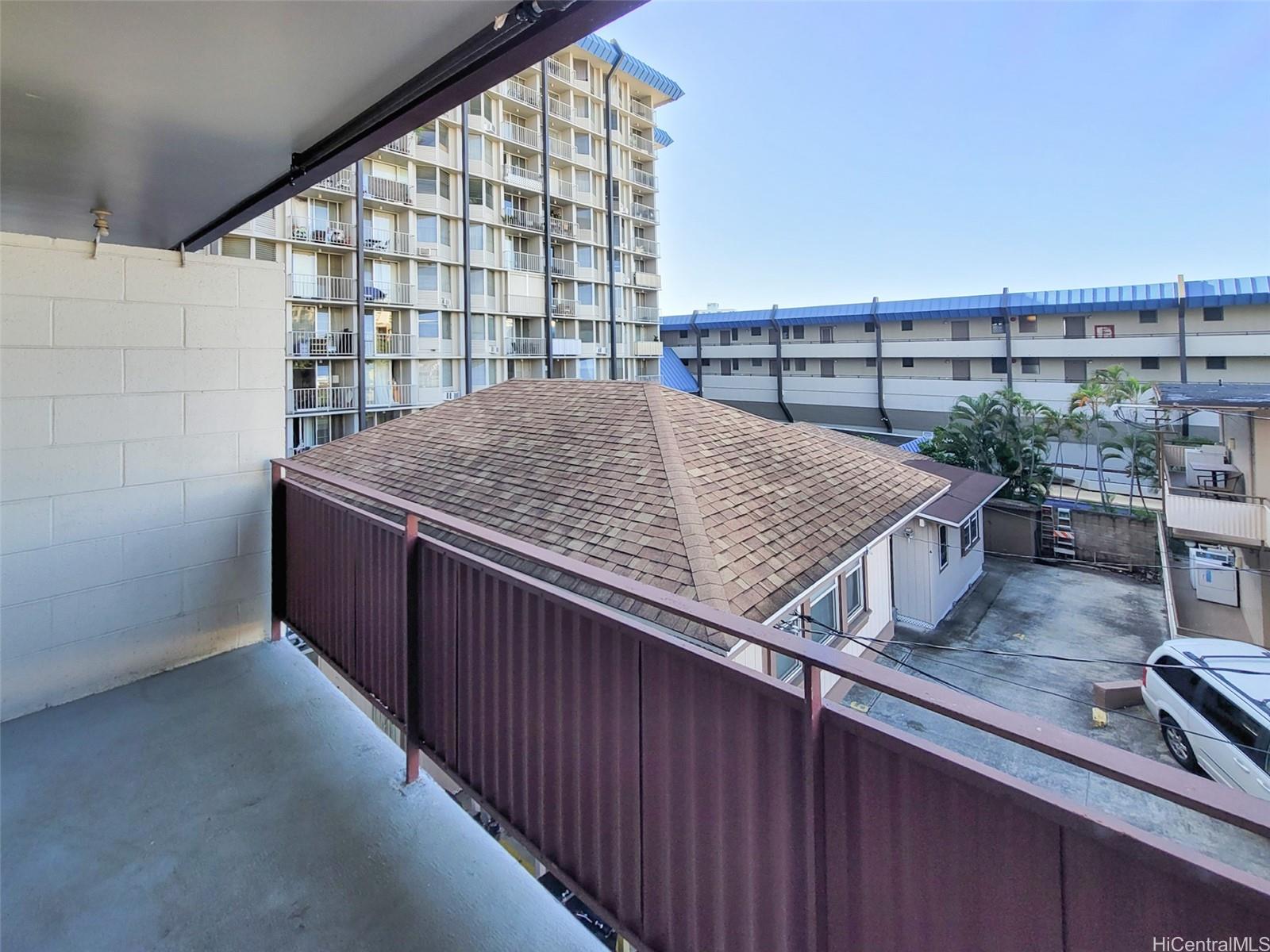 1555 Pensacola Street, Unit 302 Honolulu, HI 96822 - Photo 9 of 11 a view of swimming pool from a balcony