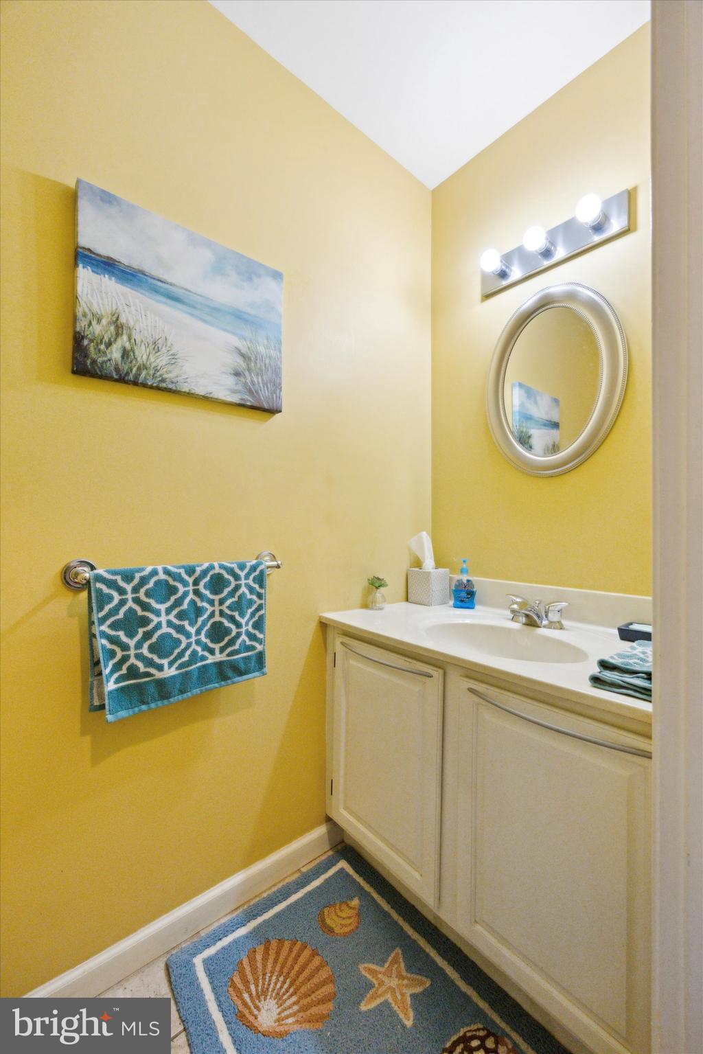 72 Victoria Drive Aston, PA 19014 - Photo 13 of 25 a bathroom with a sink a mirror and a toilet