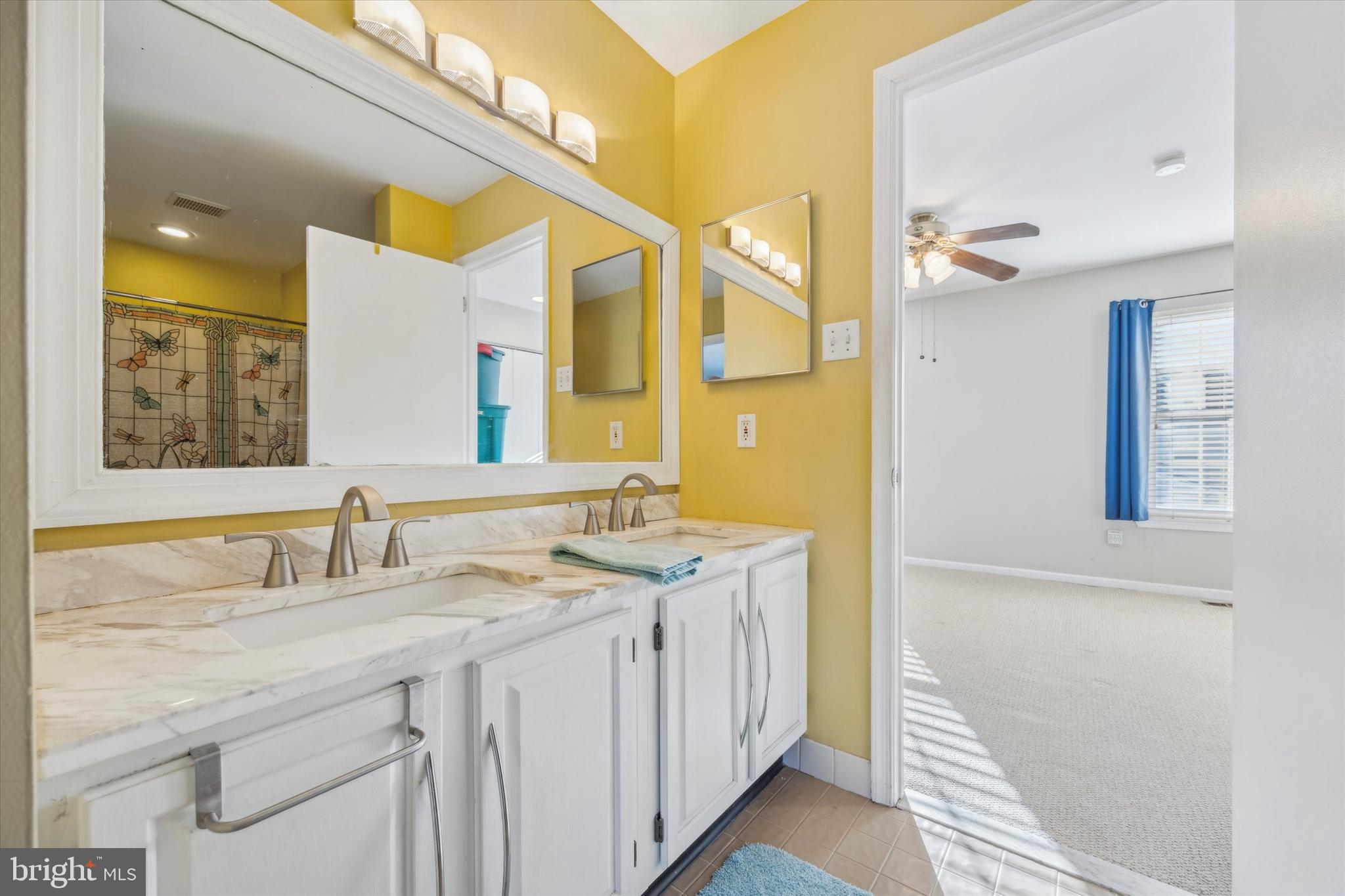 72 Victoria Drive Aston, PA 19014 - Photo 17 of 25 a bathroom with a double vanity sink and a mirror
