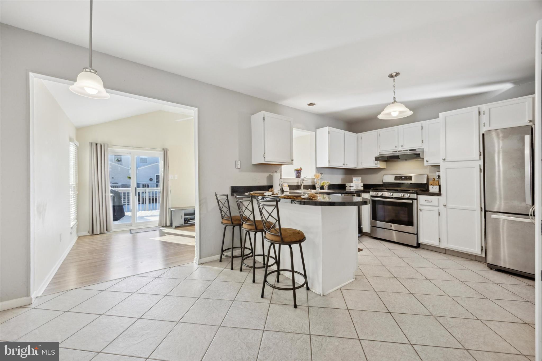 72 Victoria Drive Aston, PA 19014 - Photo 6 of 25 a kitchen with granite countertop a counter top space a sink stainless steel appliances and cabinets