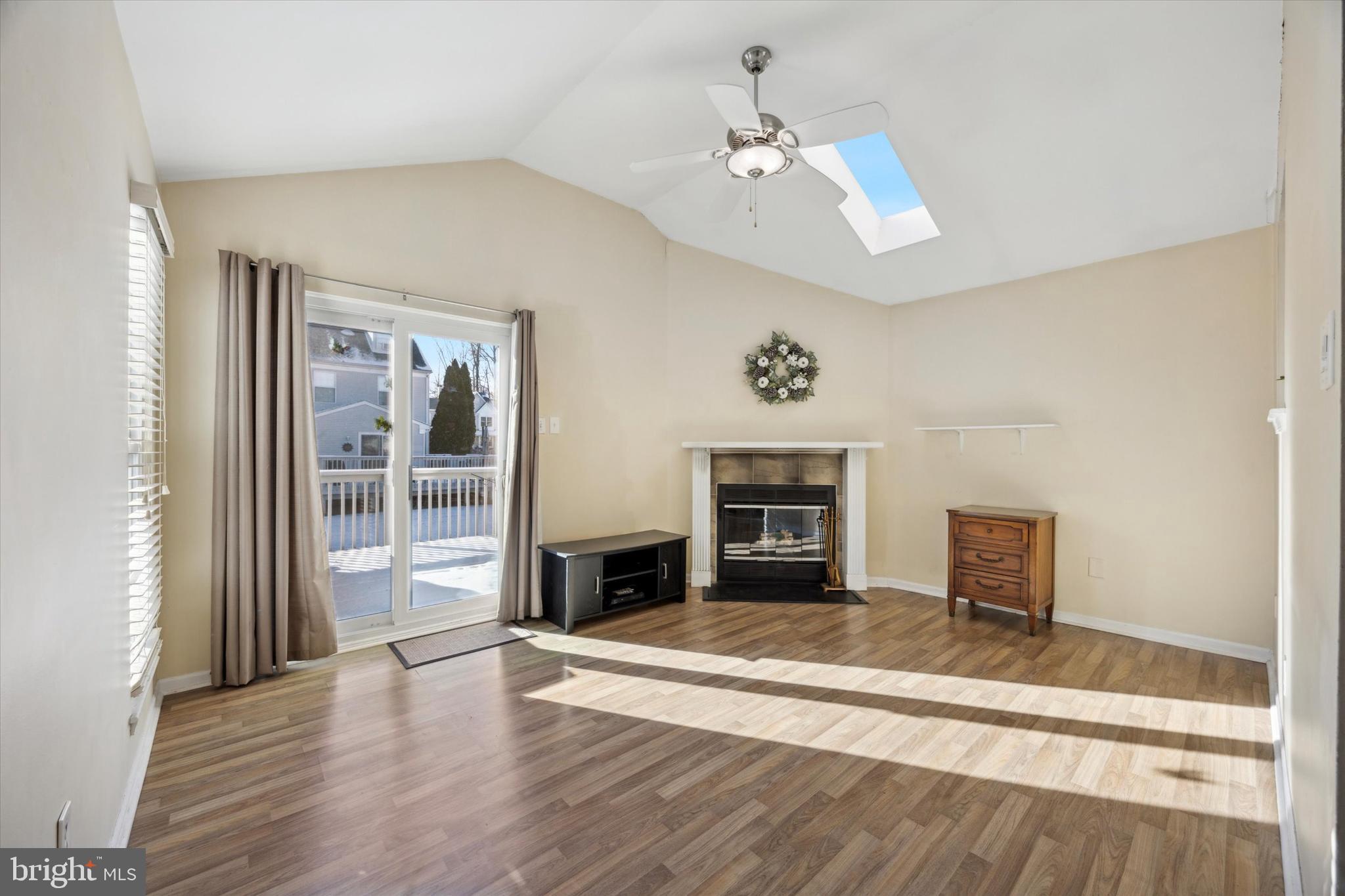 72 Victoria Drive Aston, PA 19014 - Photo 9 of 25 wooden floor fireplace and windows in an empty room