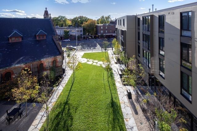 a view of a backyard with potted plants