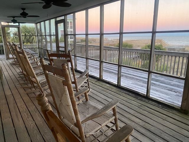 18 Canvasback Cove, Unit 122 Georgetown, SC 29440 - Photo 1 of 32 Sunroom with hardwood / wood-style flooring and a wall of windows
