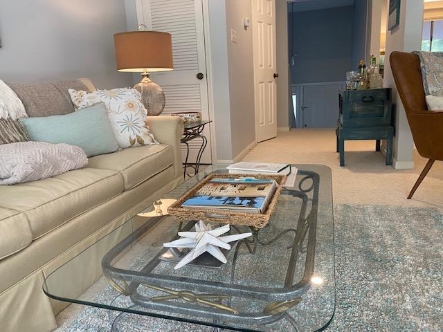 18 Canvasback Cove, Unit 122 Georgetown, SC 29440 - Photo 14 of 32 Living room featuring light carpet and baseboards