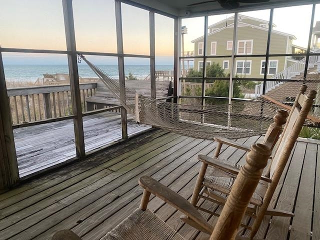 18 Canvasback Cove, Unit 122 Georgetown, SC 29440 - Photo 22 of 32 Unfurnished sunroom featuring a water view