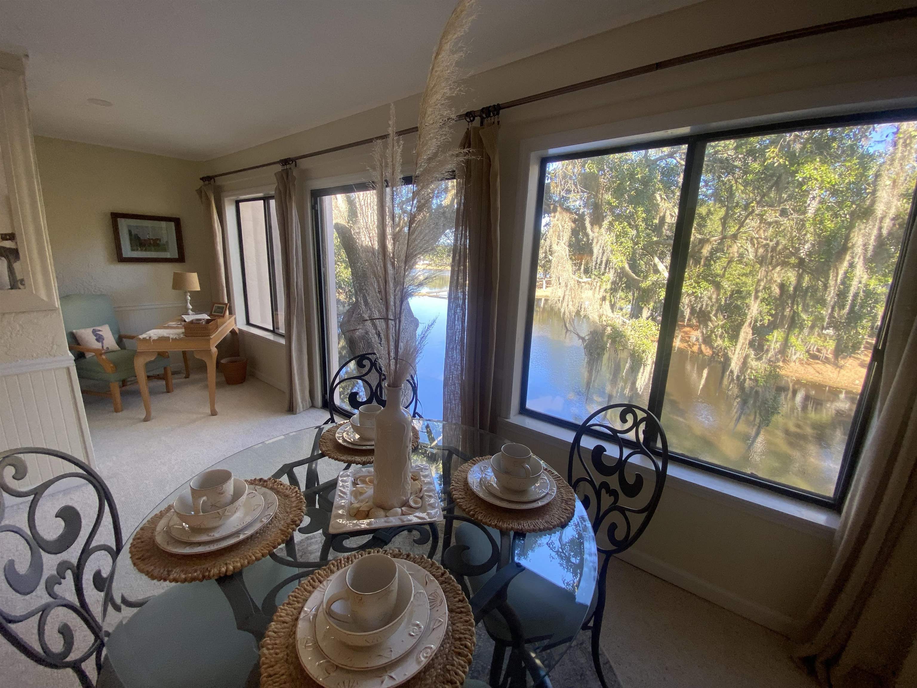 18 Canvasback Cove, Unit 122 Georgetown, SC 29440 - Photo 32 of 32 Carpeted dining space featuring a water view