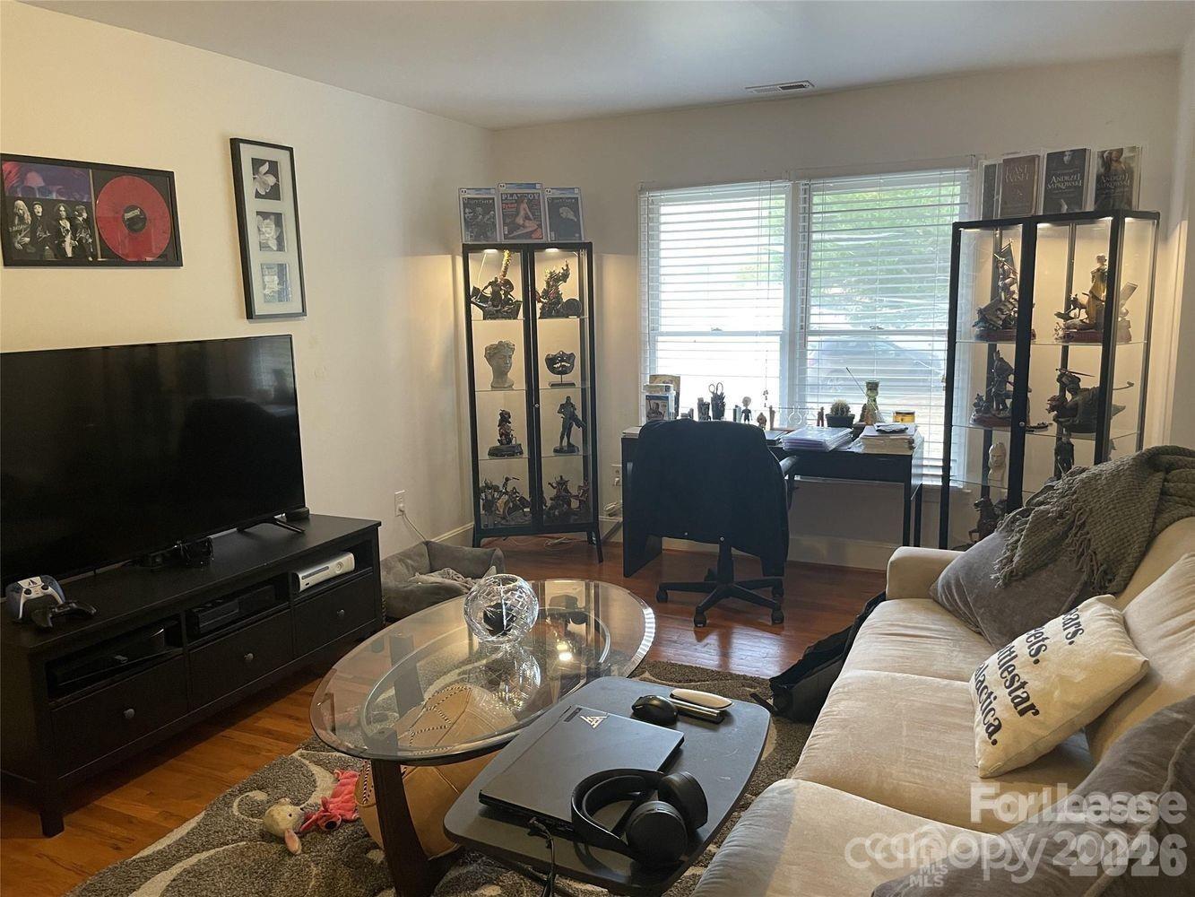 3800 Oldfield Road Charlotte, NC 28226 - Photo 24 of 32 a living room with furniture and a flat screen tv