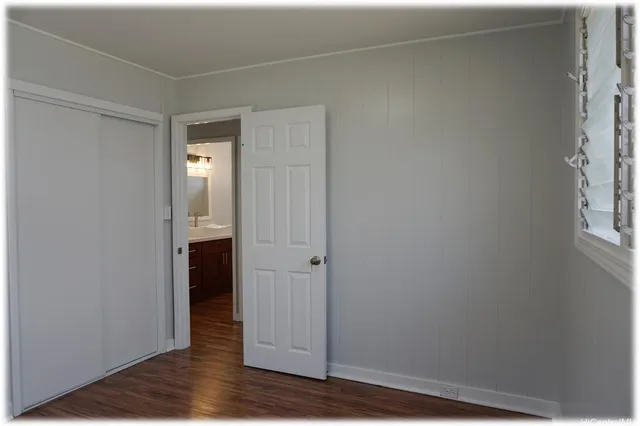 a view of a bathroom with wooden floor