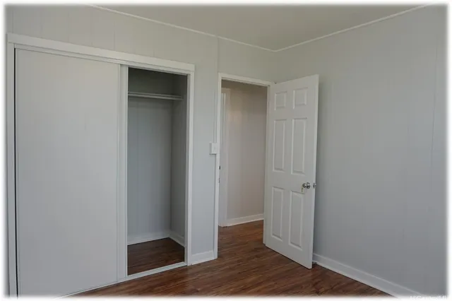 a view of a livingroom with wooden floor