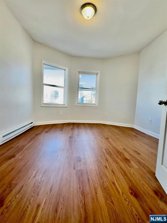 489 South 17th Street, Unit 1 Newark, NJ 07103 - Photo 3 of 9 a view of a room with wooden floor and window