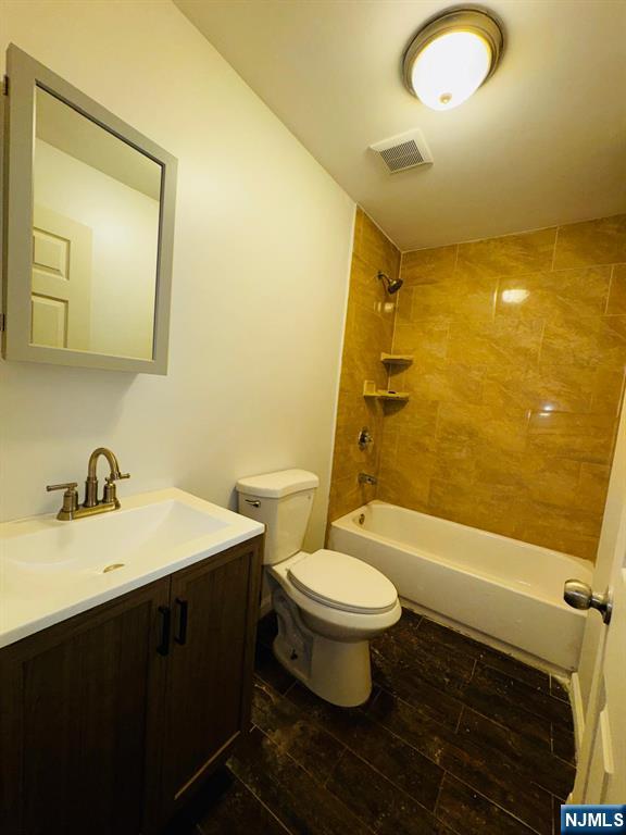 489 South 17th Street, Unit 1 Newark, NJ 07103 - Photo 5 of 9 a bathroom with a sink and a mirror