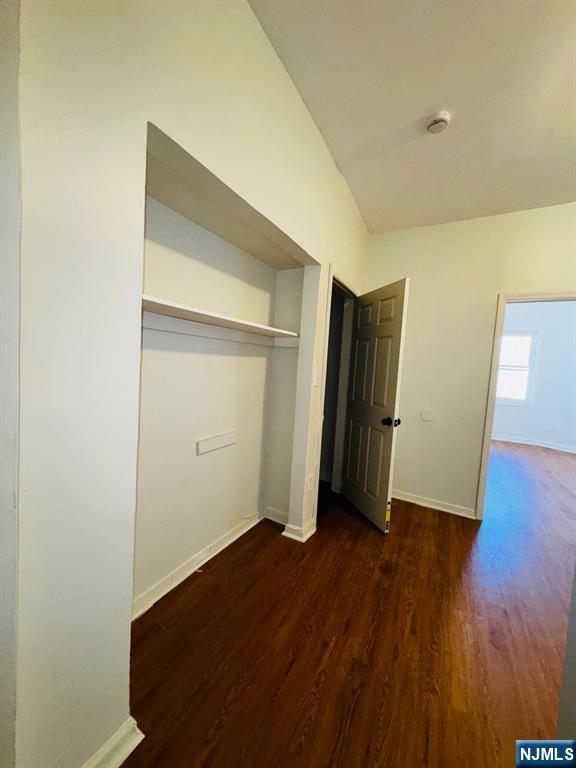 489 South 17th Street, Unit 1 Newark, NJ 07103 - Photo 7 of 9 an empty room with wooden floor and closet