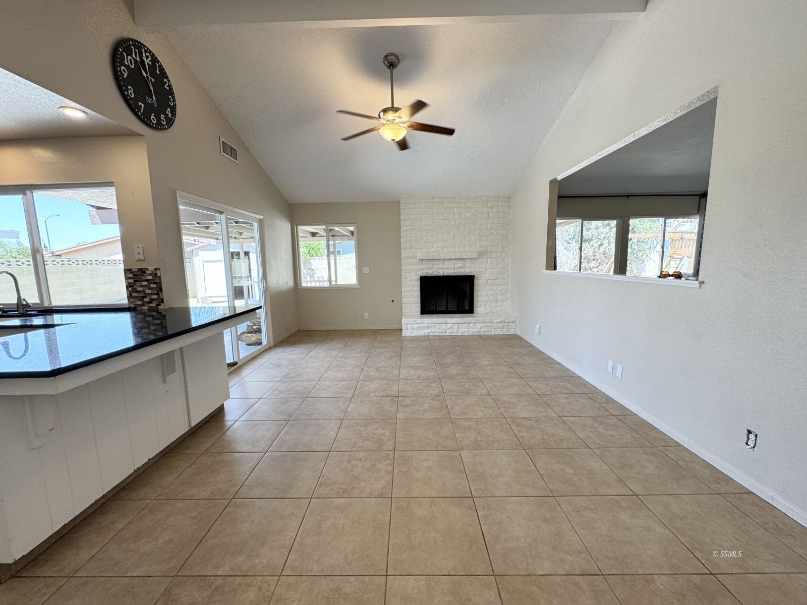 905 North Sierra View Street Ridgecrest, CA 93555 - Photo 10 of 30 a large white kitchen with a large window