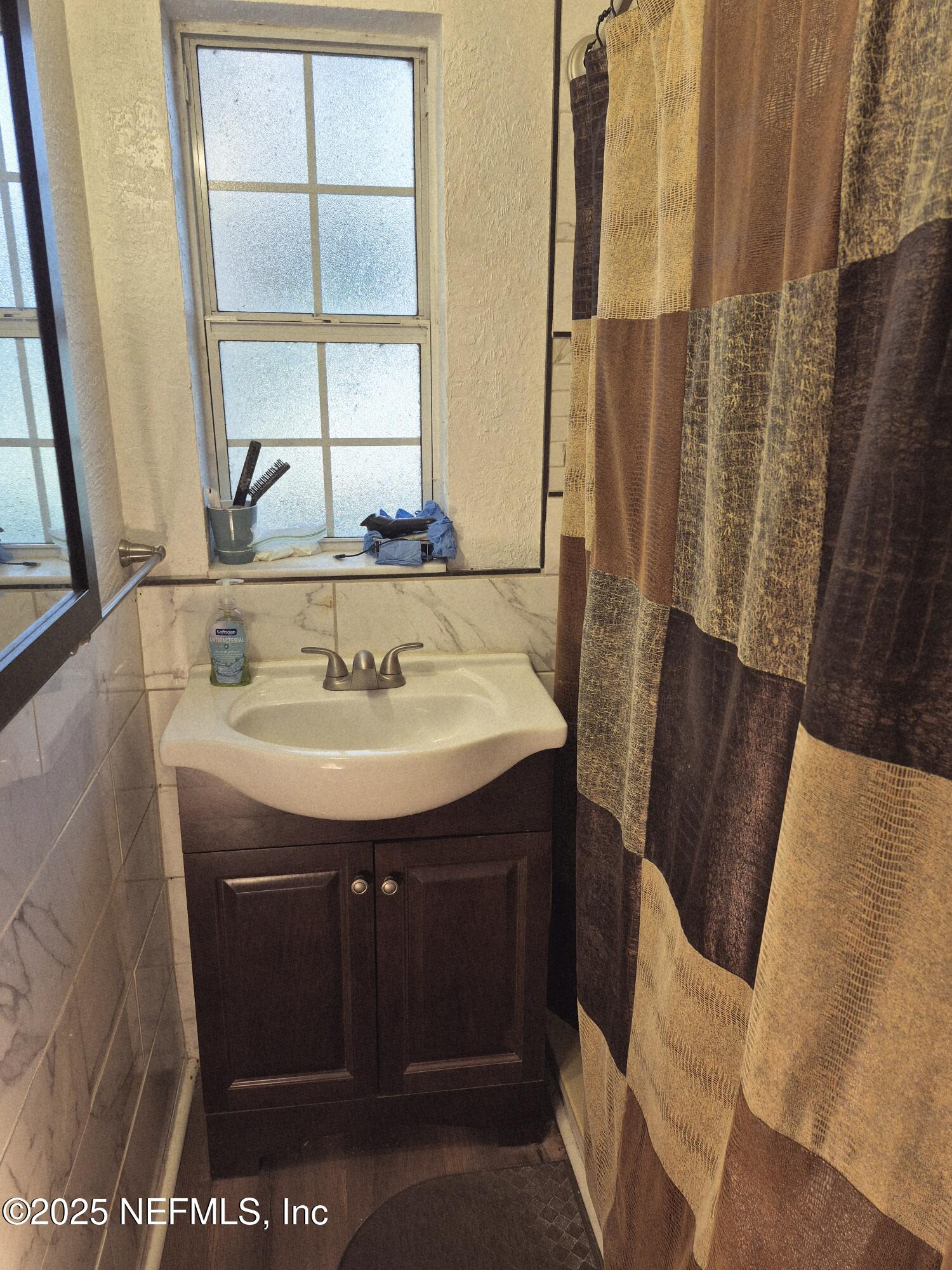 282 Byrd Road Crescent City, FL 32112 - Photo 16 of 24 a bathroom with a sink and a mirror