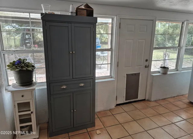a view of a kitchen with a window