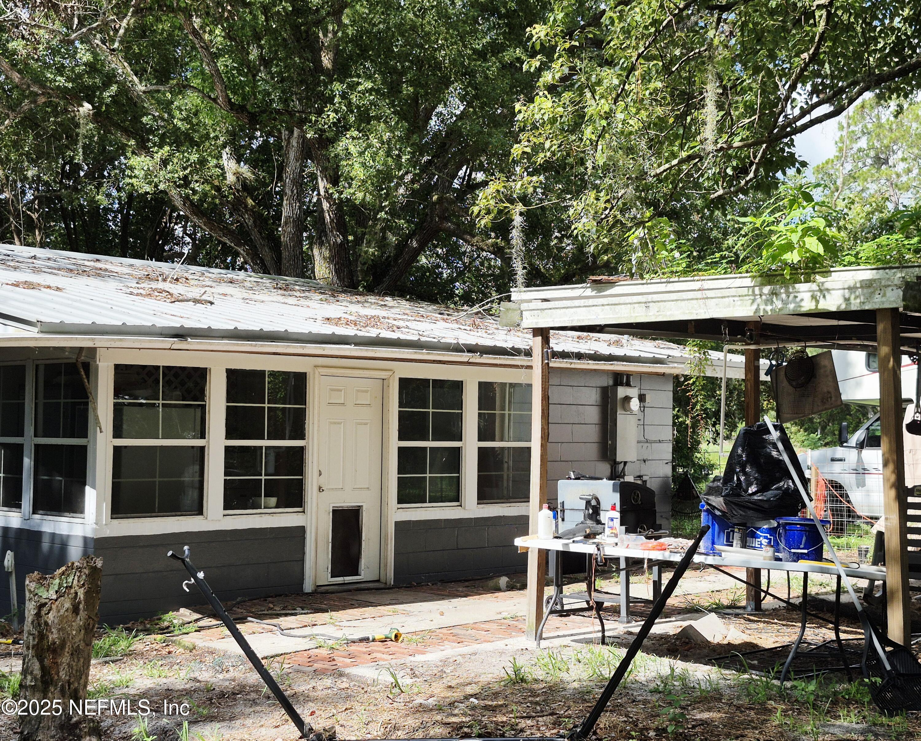 282 Byrd Road Crescent City, FL 32112 - Photo 19 of 24 a view of a house with backyard porch and sitting area