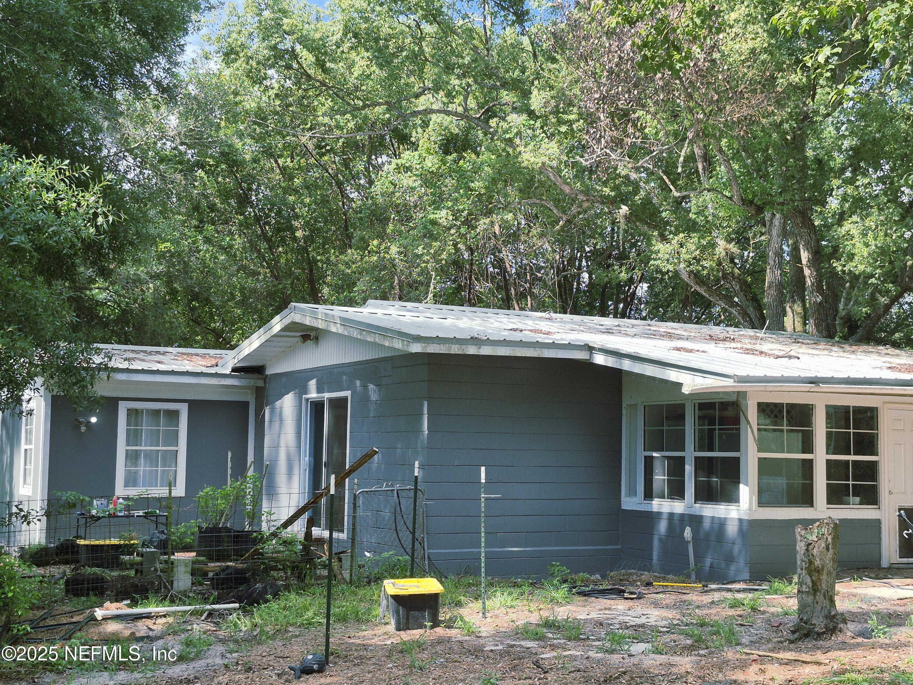 282 Byrd Road Crescent City, FL 32112 - Photo 4 of 24 a front view of a house with garden