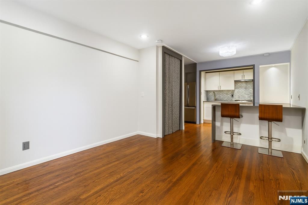 3050 Edwin Avenue, Unit 2D Fort Lee, NJ 07024 - Photo 14 of 21 a view of a livingroom with furniture and wooden floor