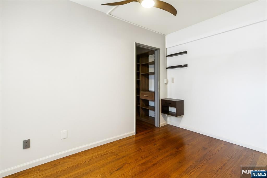 3050 Edwin Avenue, Unit 2D Fort Lee, NJ 07024 - Photo 16 of 21 a view of an empty room with wooden floor