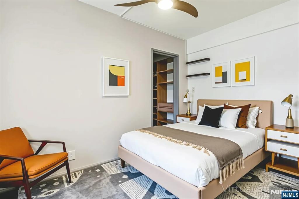 3050 Edwin Avenue, Unit 2D Fort Lee, NJ 07024 - Photo 7 of 21 a bedroom with a bed and chair