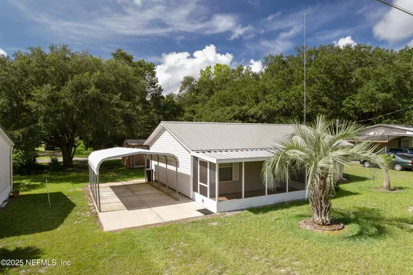 a view of a house with a yard