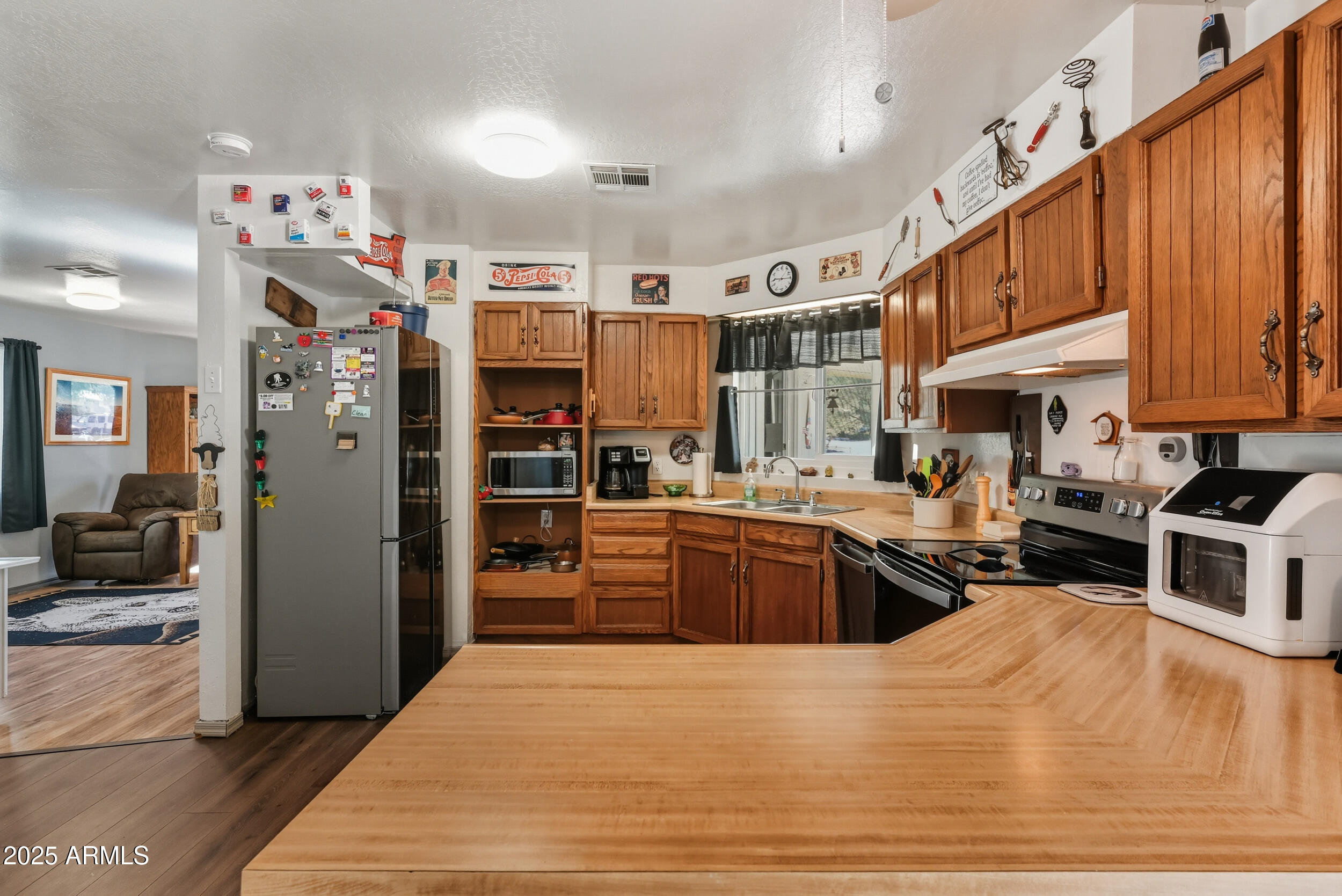 500 East Lorene Street Payson, AZ 85541 - Photo 18 of 41 a kitchen with stainless steel appliances kitchen island granite countertop a refrigerator and a stove top oven