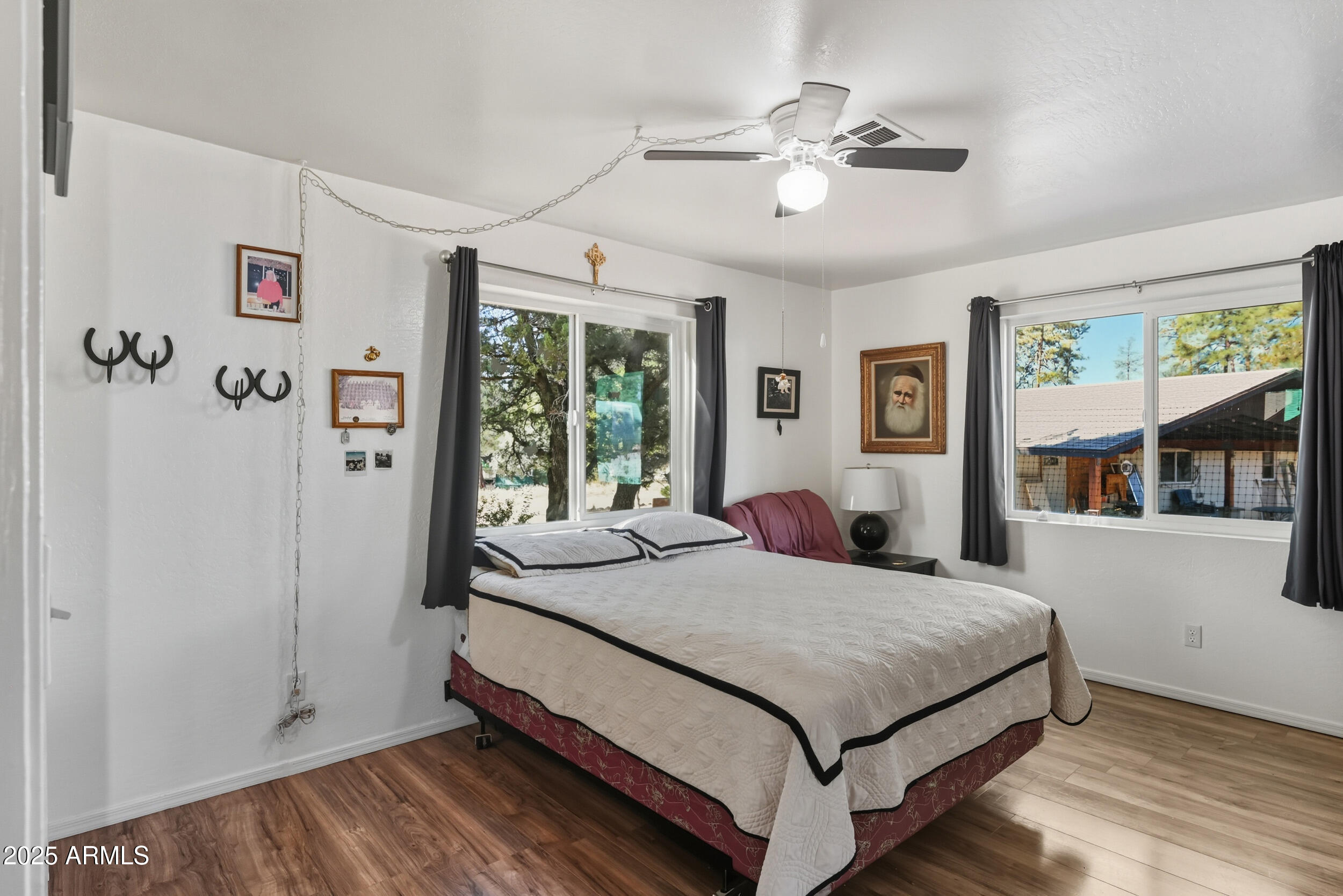 500 East Lorene Street Payson, AZ 85541 - Photo 20 of 41 a bedroom with a large bed and a chandelier