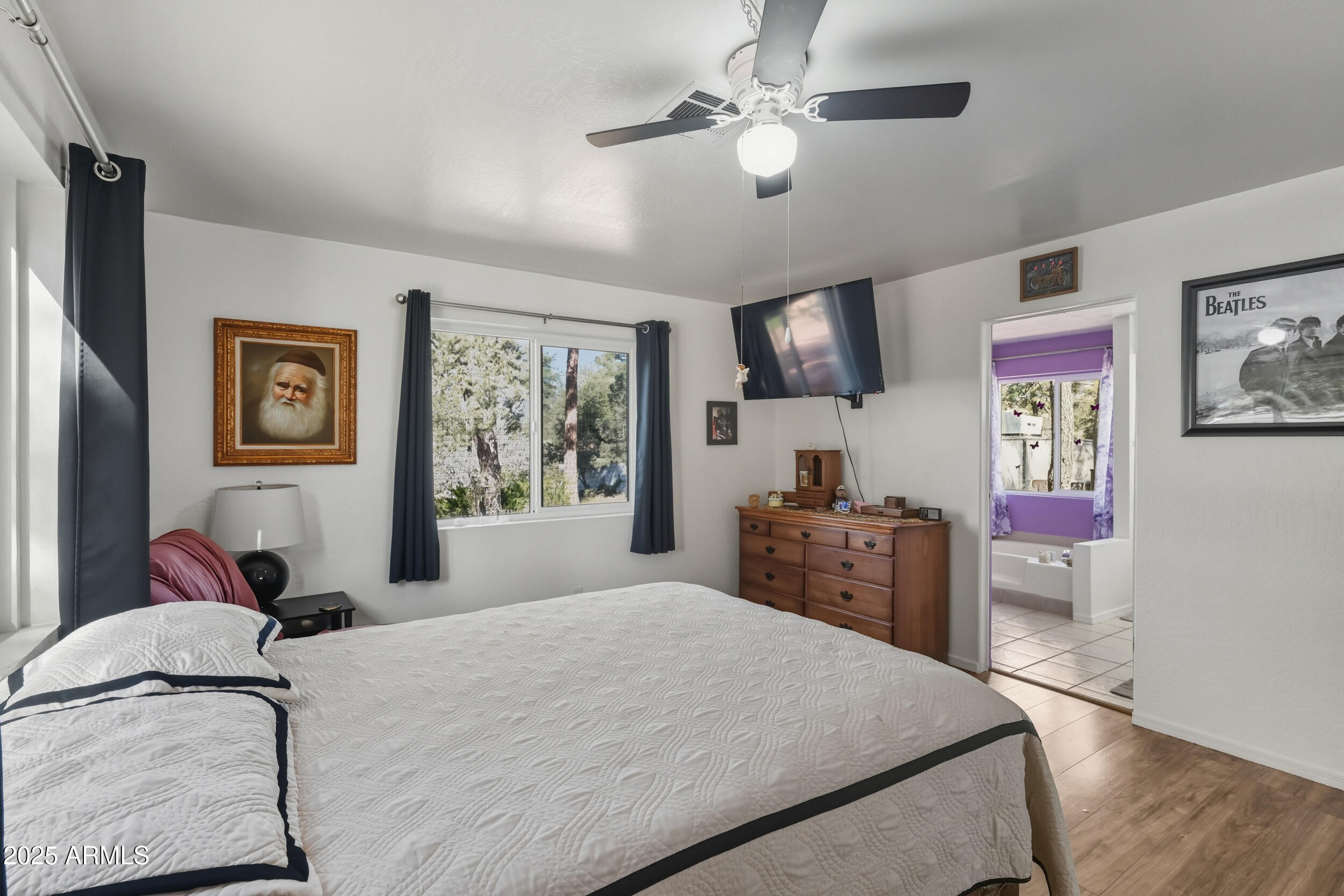 500 East Lorene Street Payson, AZ 85541 - Photo 22 of 41 a bedroom with a bed and dresser with mirror