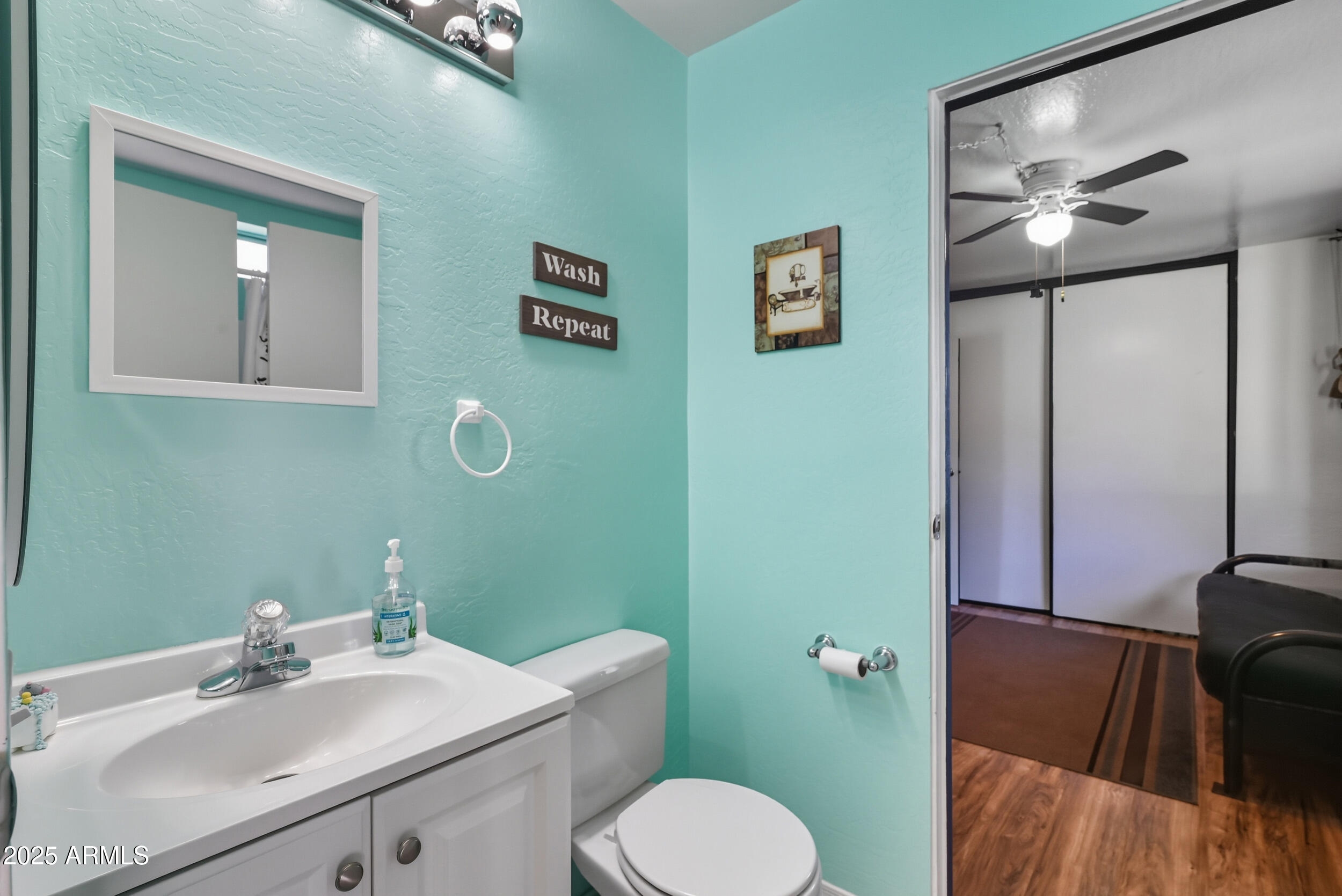 500 East Lorene Street Payson, AZ 85541 - Photo 27 of 41 a bathroom with a sink mirror vanity and toilet