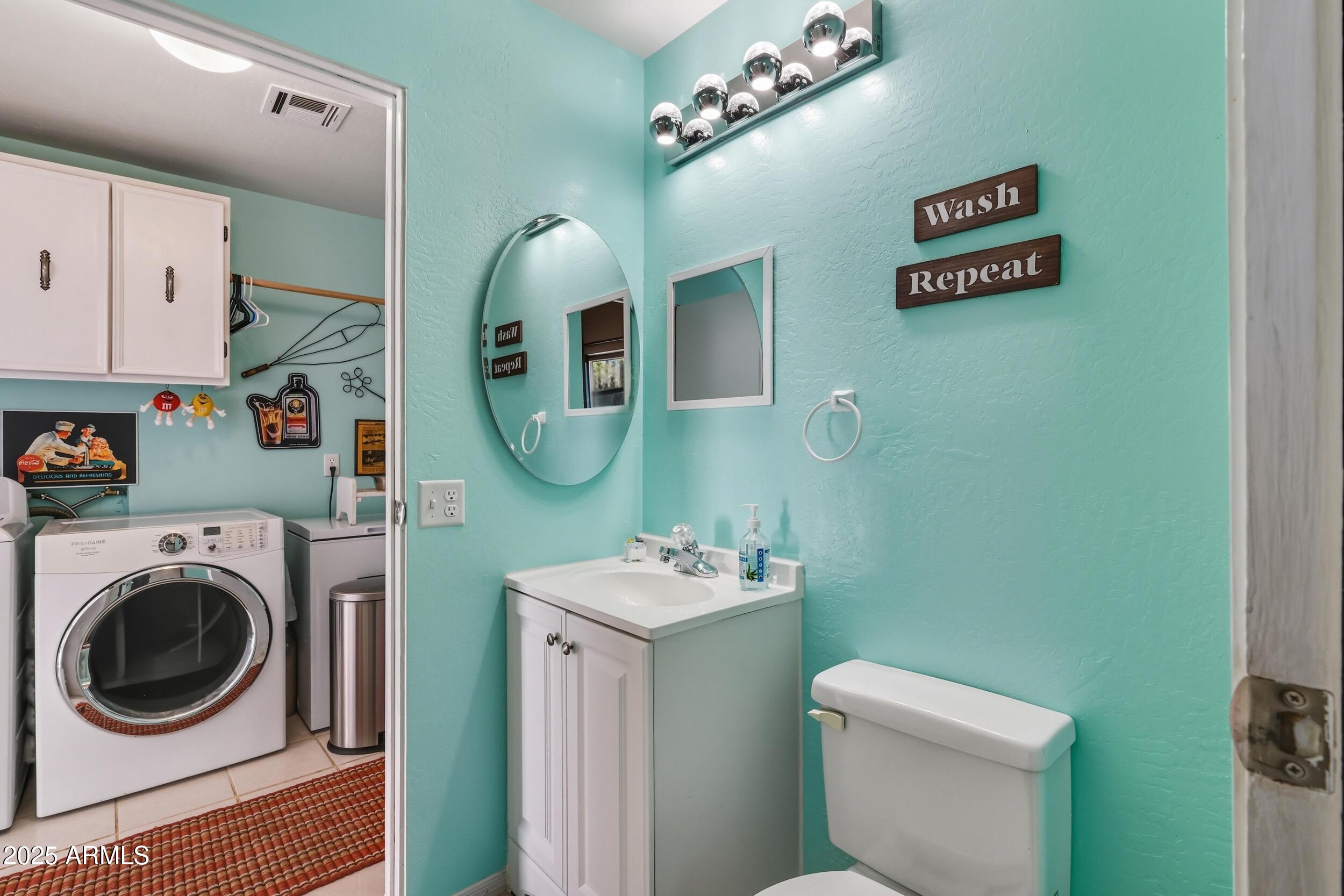 500 East Lorene Street Payson, AZ 85541 - Photo 29 of 41 a bathroom with a toilet a sink and mirror