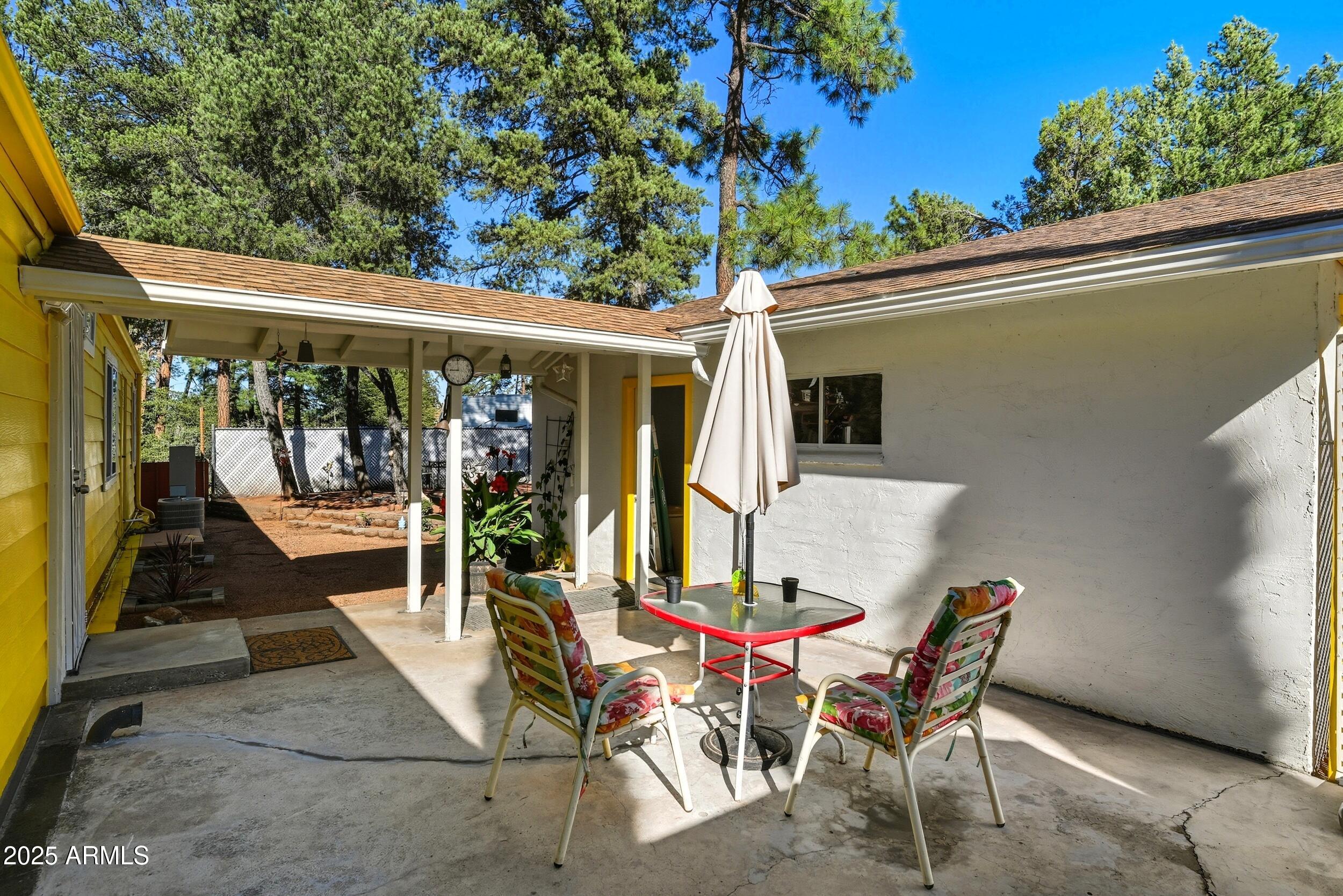 500 East Lorene Street Payson, AZ 85541 - Photo 35 of 41 a view of a patio with table and chairs and potted plants