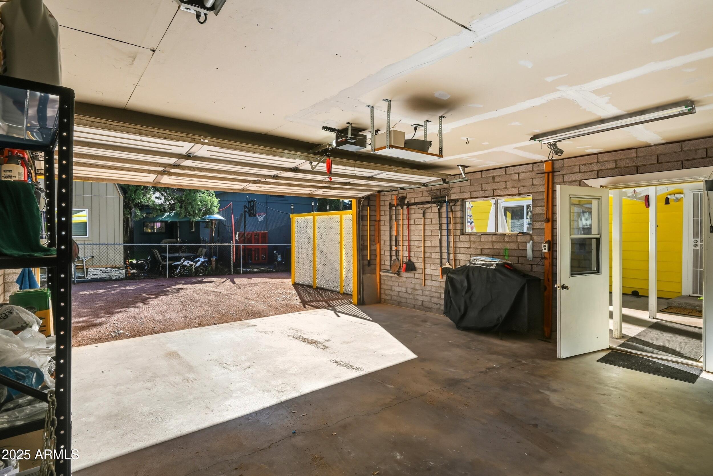500 East Lorene Street Payson, AZ 85541 - Photo 36 of 41 a living room with furniture a flat screen tv and floor to ceiling window
