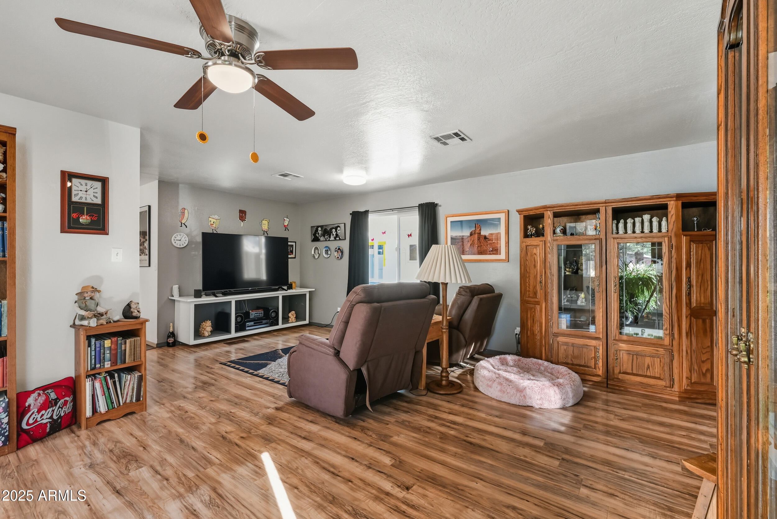 500 East Lorene Street Payson, AZ 85541 - Photo 9 of 41 a living room with furniture a flat screen tv and a floor to ceiling window