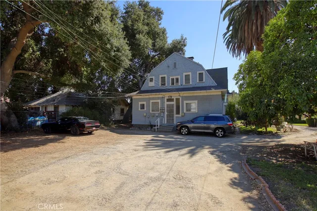 a view of a town with large trees