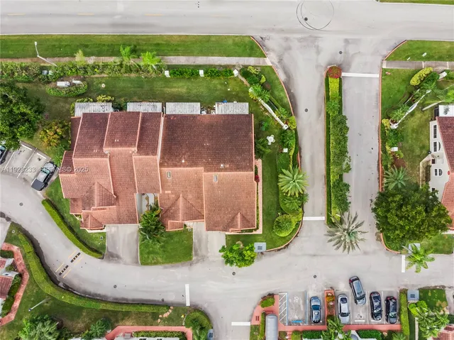 an aerial view of residential houses with outdoor space