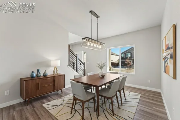 a view of a room with wooden floor