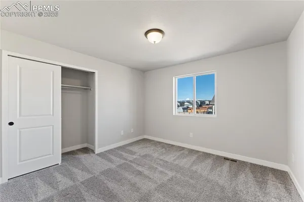 a view of room with window and closet