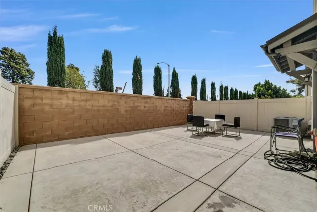 a view of swimming pool with chairs