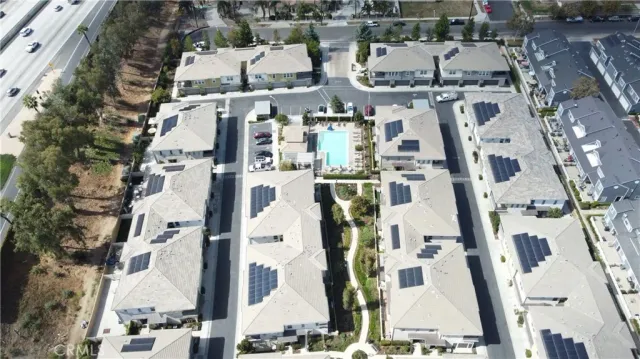 an aerial view of residential houses with outdoor space