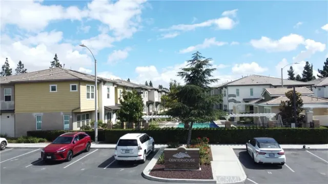 a front view of a house with a garden and patio