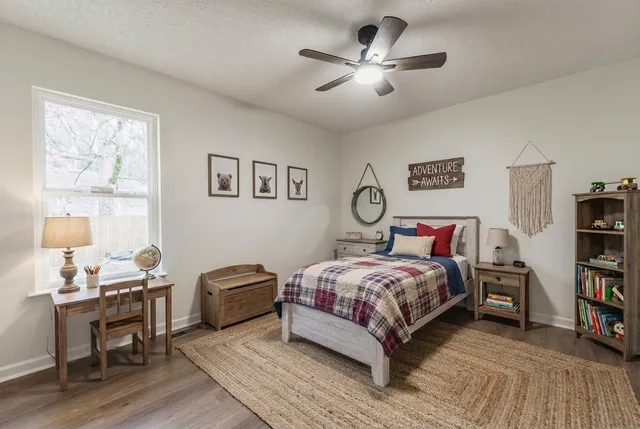 a bedroom with a bed and a book shelf