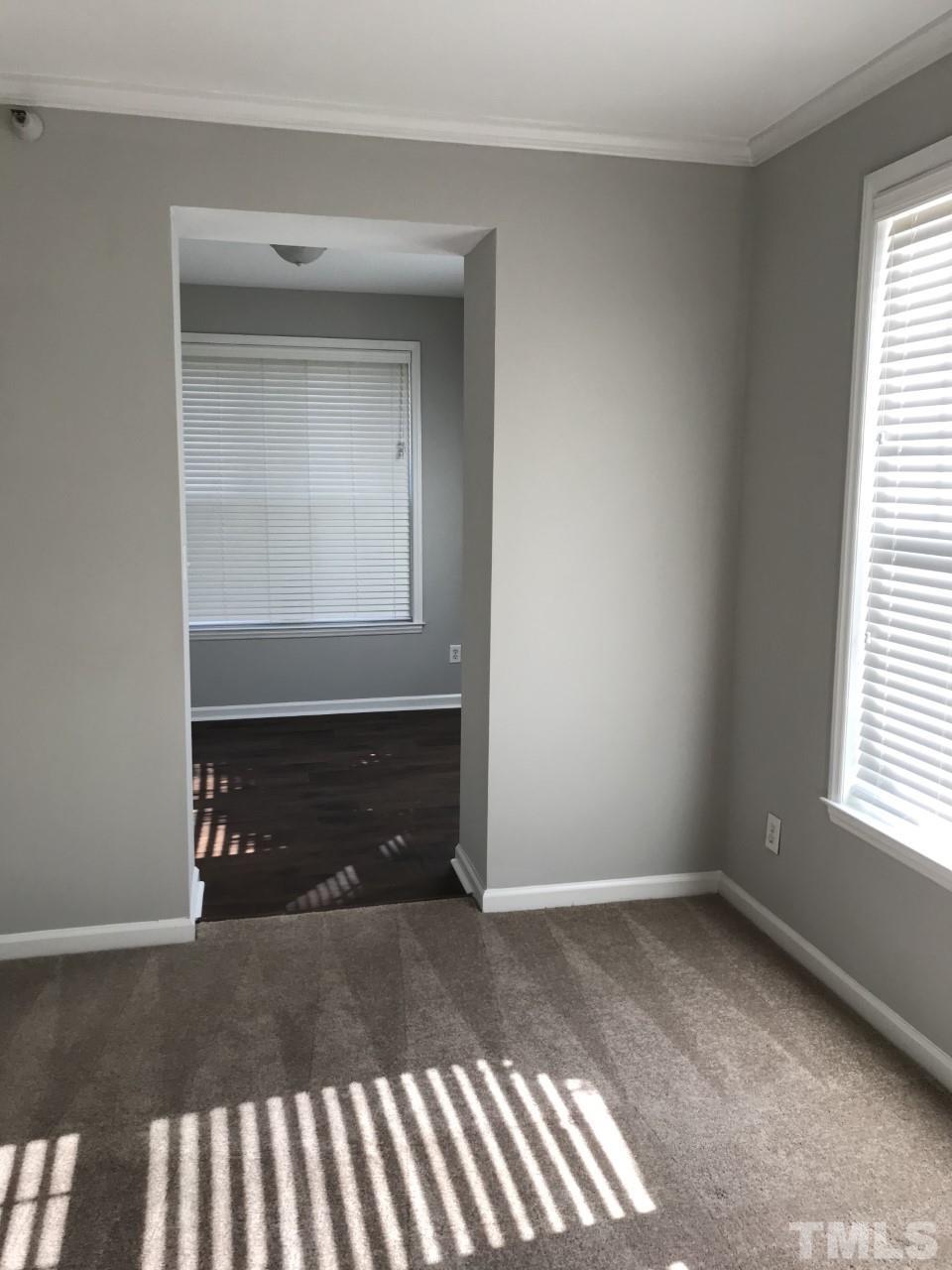 1701 Tiffany Bay Court, Unit 102 Raleigh, NC 27609 - Photo 7 of 13 a view of an empty room and window
