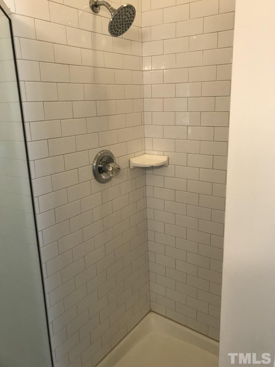 1701 Tiffany Bay Court, Unit 102 Raleigh, NC 27609 - Photo 9 of 13 a bathroom with a shower